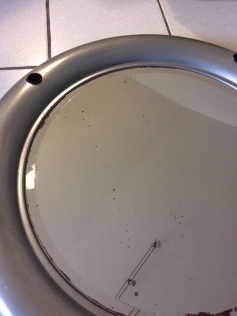 Vintage bright round bathroom mirror in metal