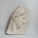 Visage antique en relief