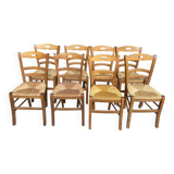 12 solid wood and straw chairs