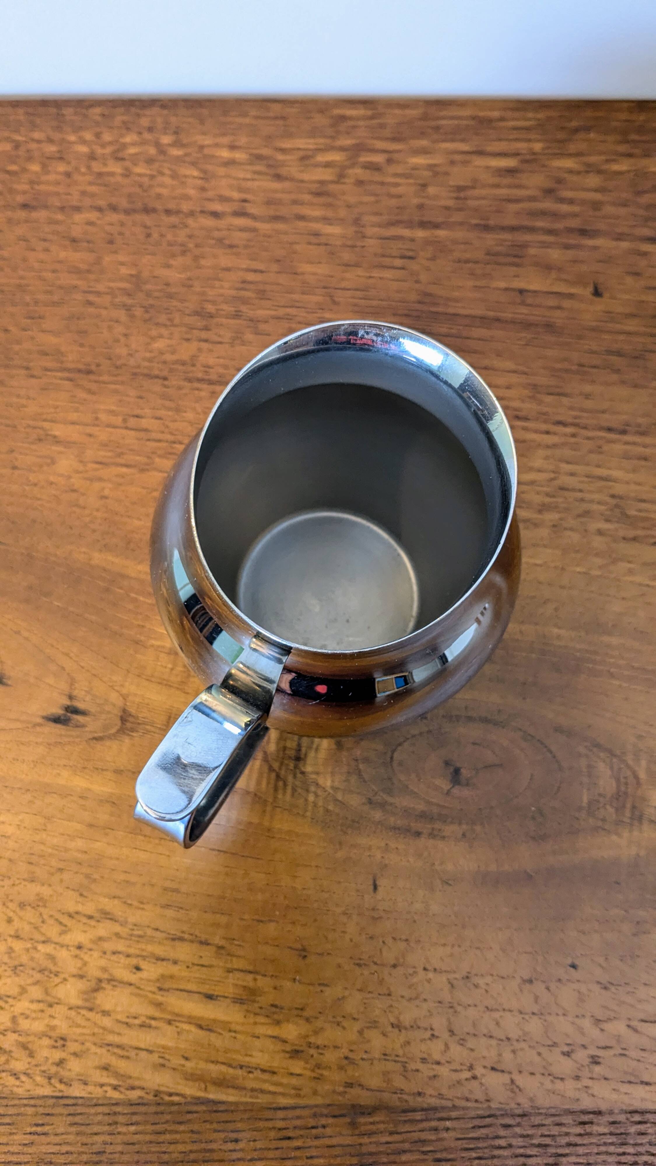 Antique stainless steel milk jug by Remy Letang