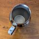 Antique stainless steel milk jug by Remy Letang