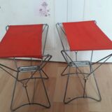 Folding stool in red canvas but unstitched on one side