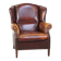 Comfortable, elegant, stately wing chair made of sheepskin in a beautiful warm color