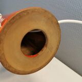 Ceramic table lamp with partial orange glaze.
