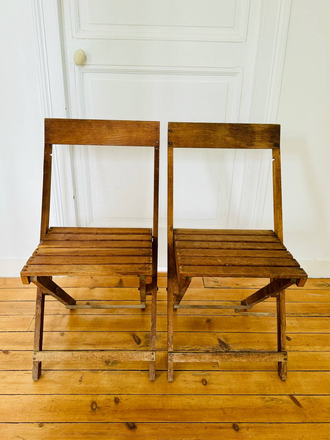 Two vintage wooden folding chairs, circa 1960