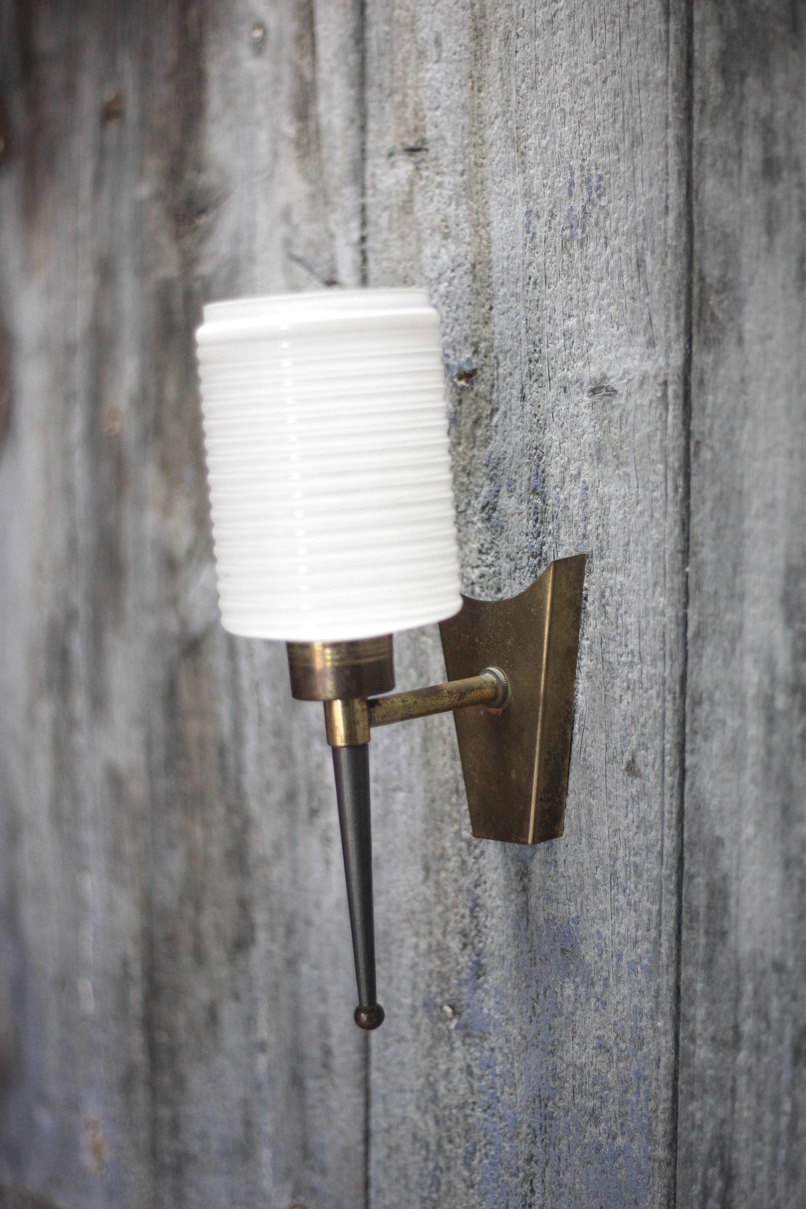 Brass wall light, black lacquered metal and white opal glass, 50s.
