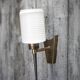 Brass wall light, black lacquered metal and white opal glass, 50s.