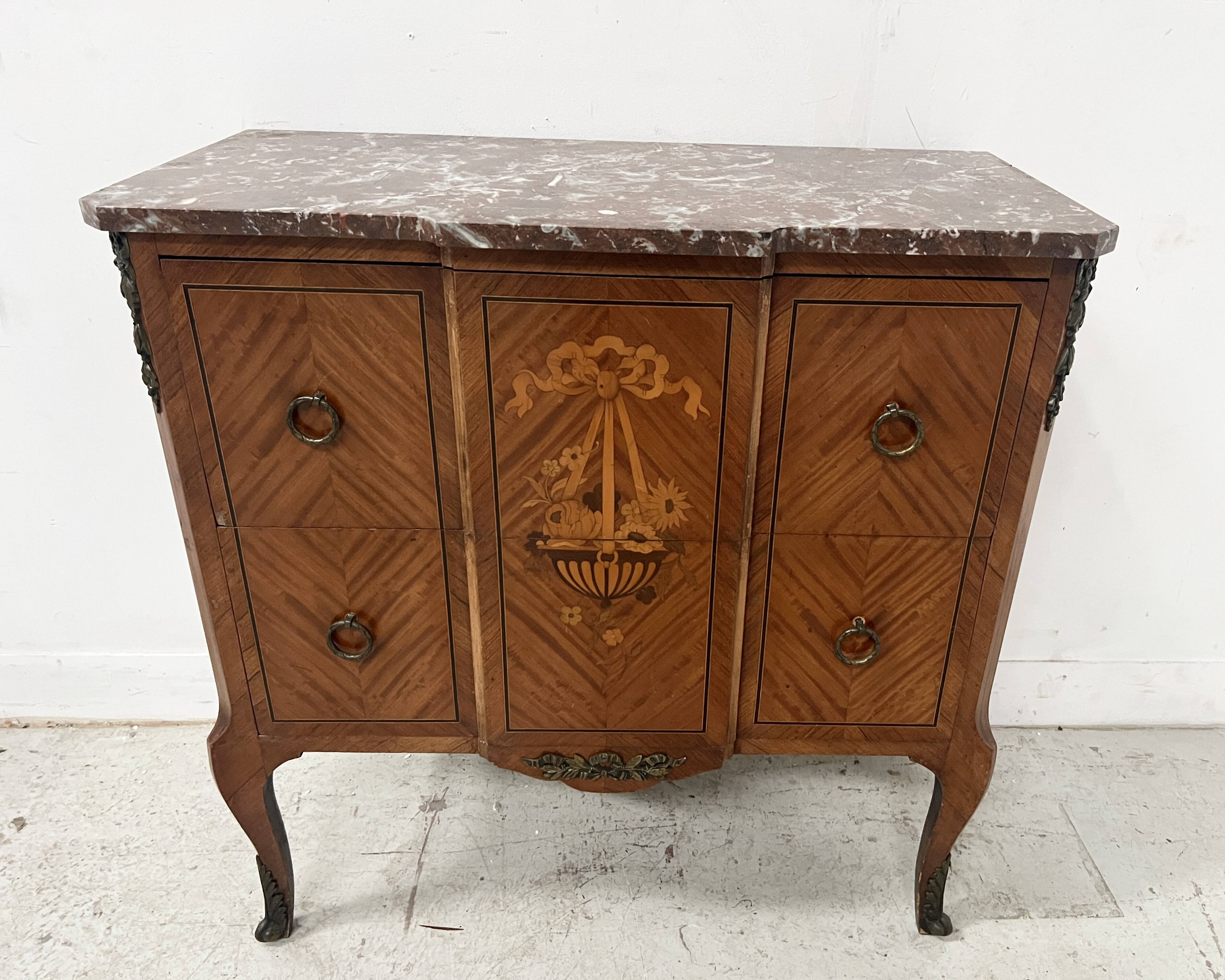 Transitional style commode with a protruding front, in marquetry wood, 20th century.