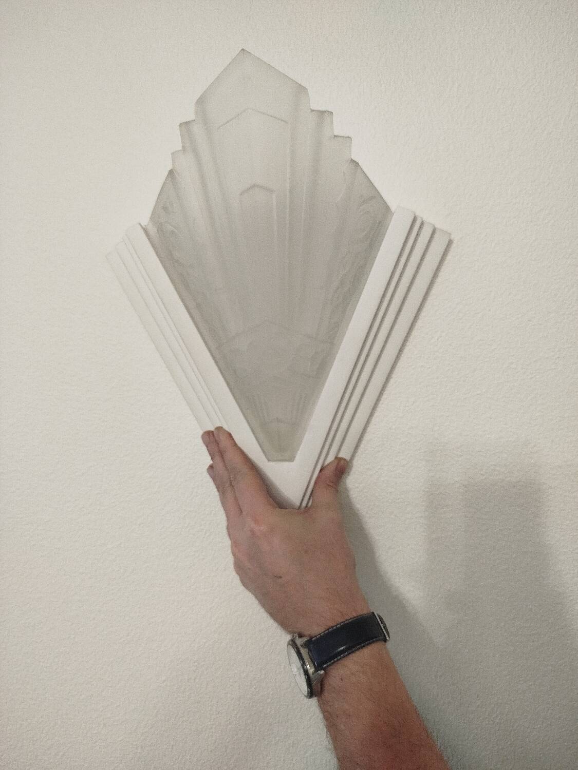 Pair of Art Deco wall sconces in plaster and pressed glass.