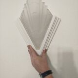 Pair of Art Deco wall sconces in plaster and pressed glass.