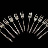 12 fourchettes à gâteaux en métal argenté Ercuis