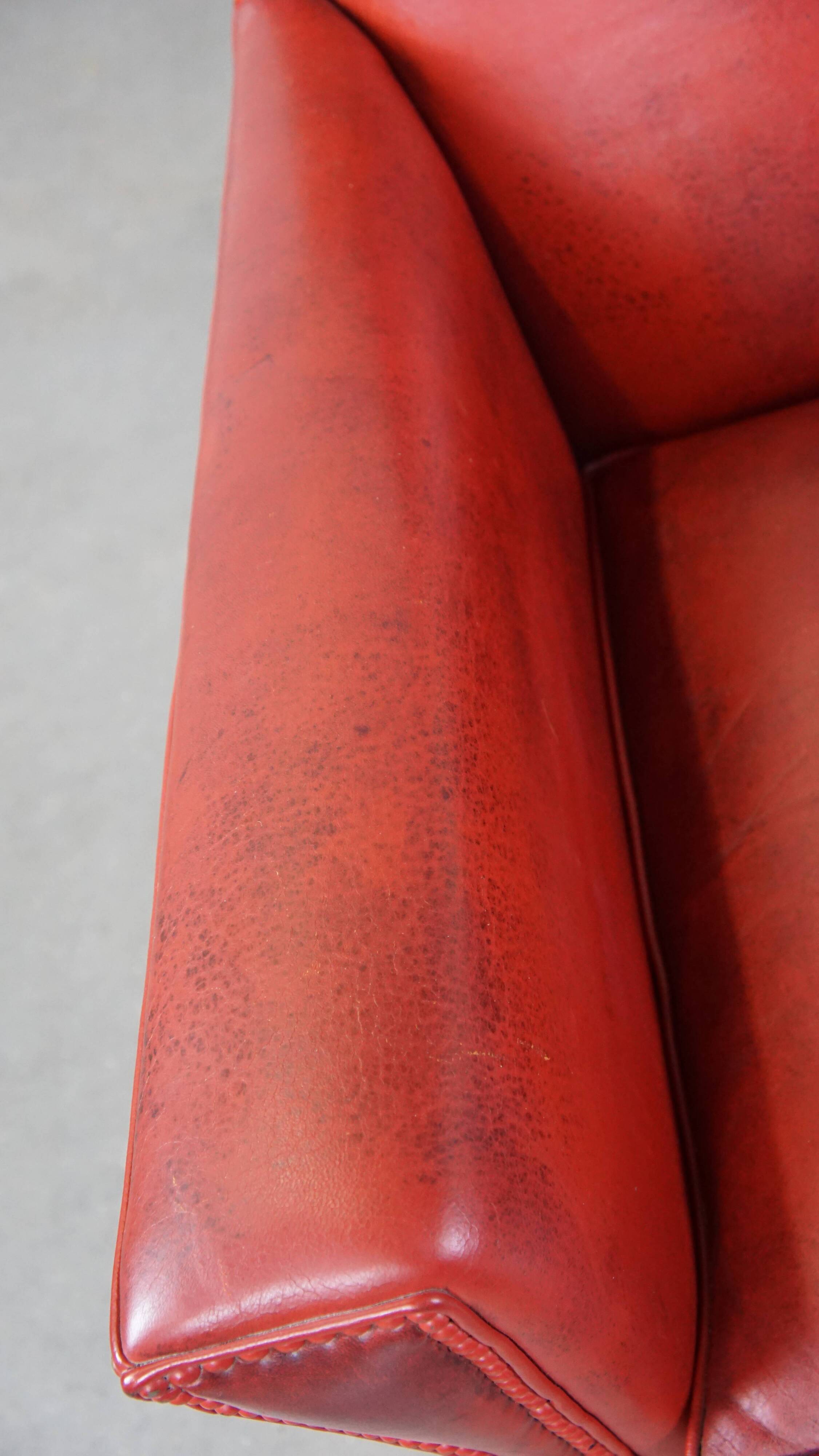 Red-painted armchair made of sheepskin leather