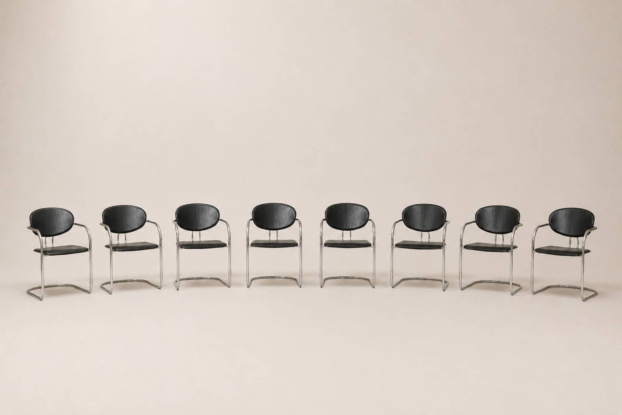 Set of eight cantilever chairs in black faux leather and chrome steel — c. 1980