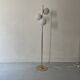 Cluster floor lamp with 3 spherical lamps in gold metal and white glass