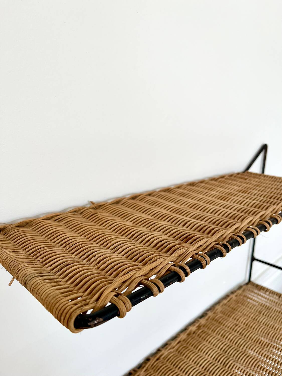 Raoul Guys rattan wall shelf 1950