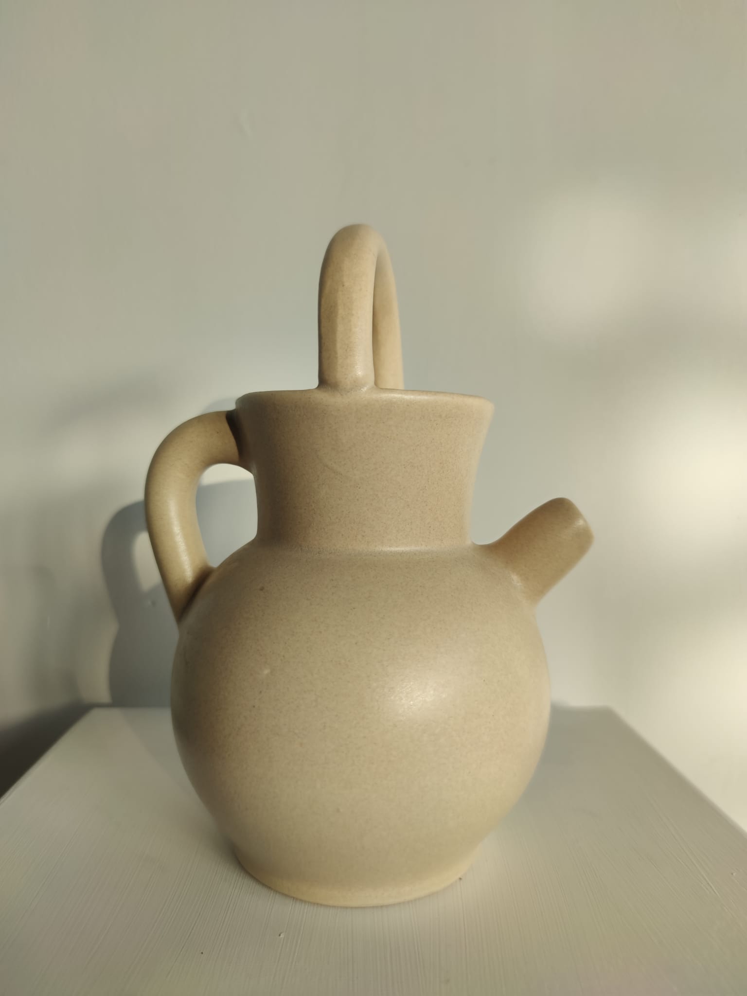 Pitcher ball in sandstone with floral pattern