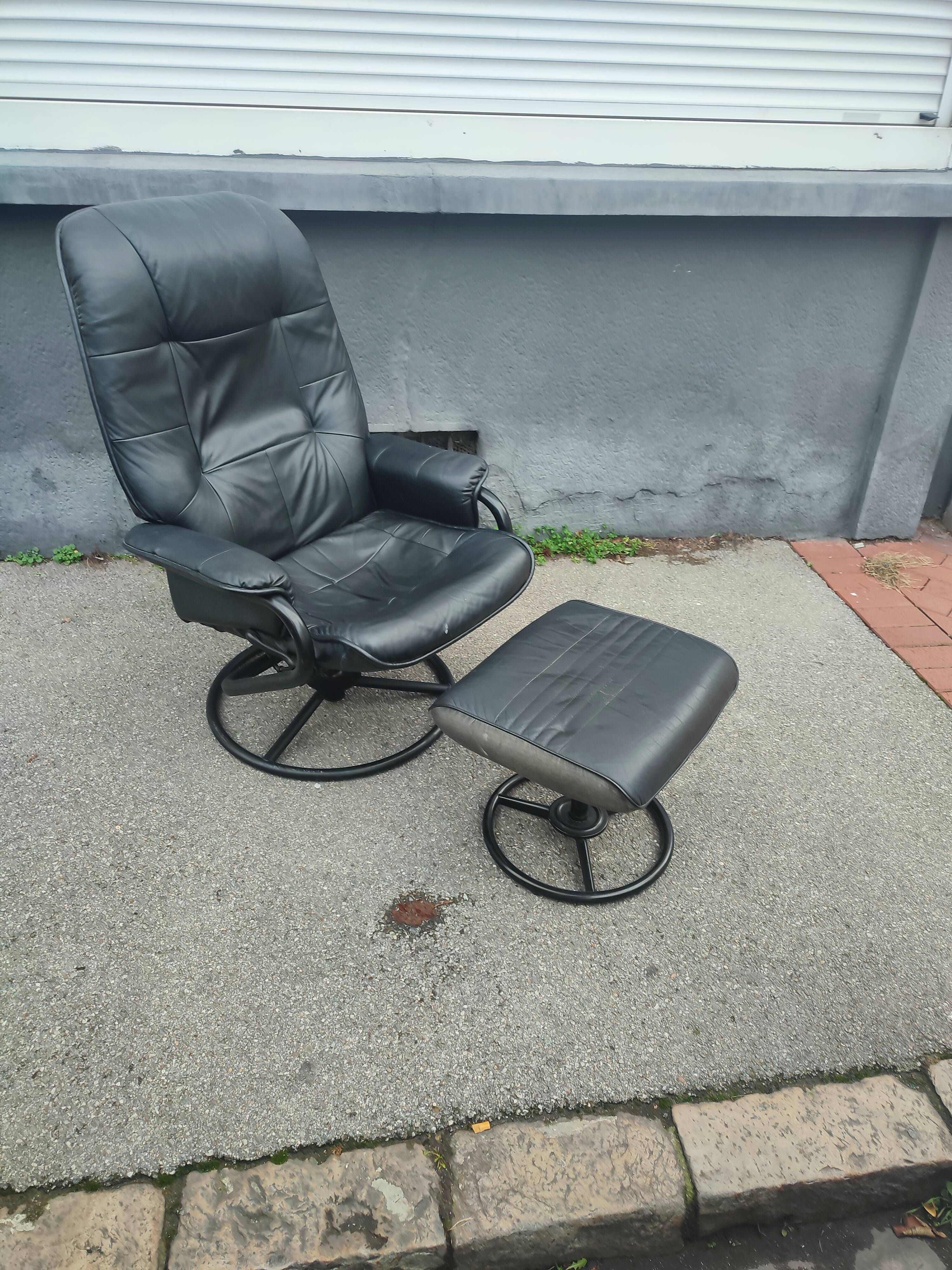 Scandinavian design leather armchair and footrest