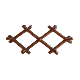 1900 accordion coat holder