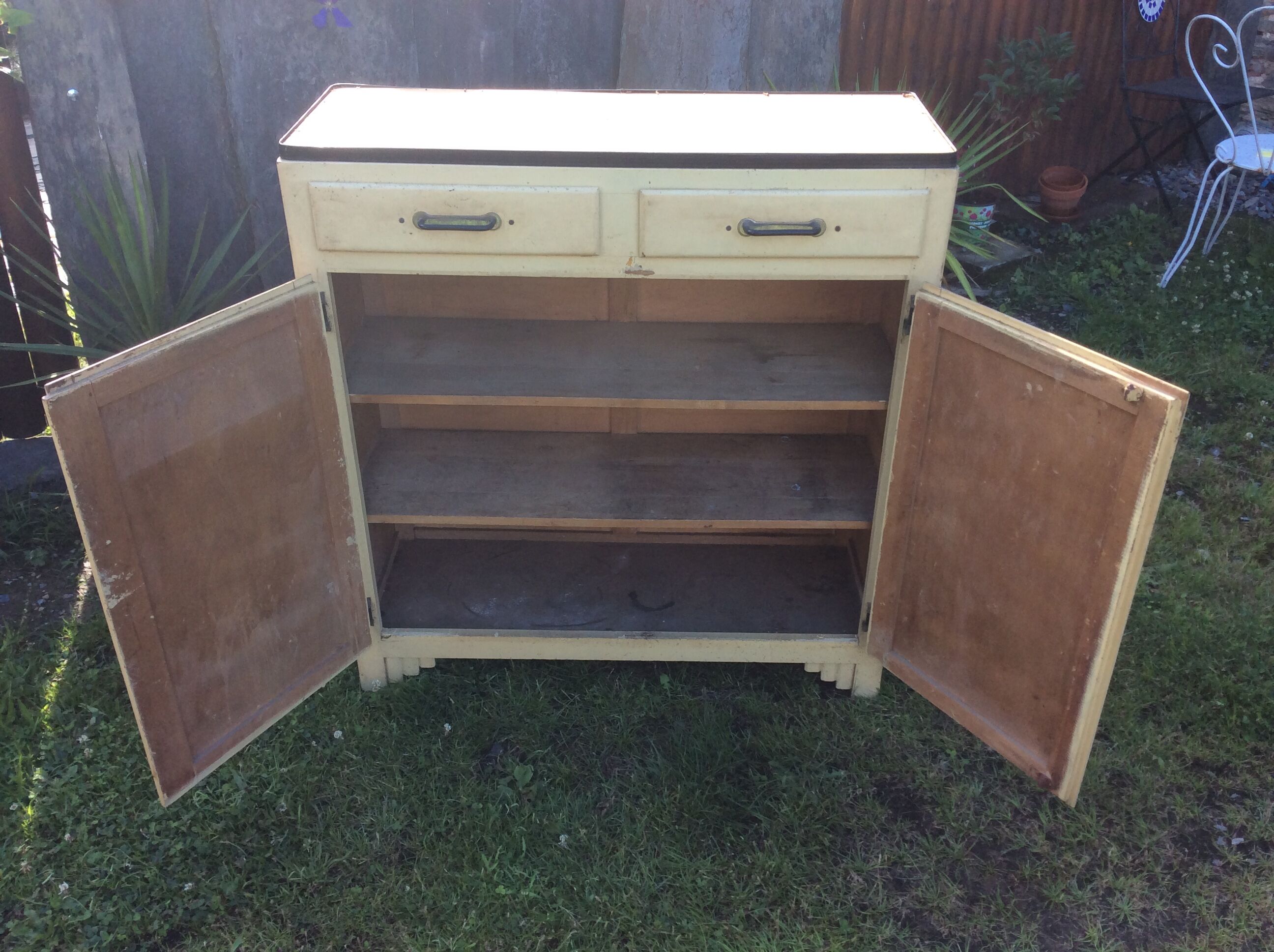 Parisian buffet painted in yellow with 2 doors and 2 drawers from an old Trailer.