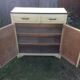 Parisian buffet painted in yellow with 2 doors and 2 drawers from an old Trailer.