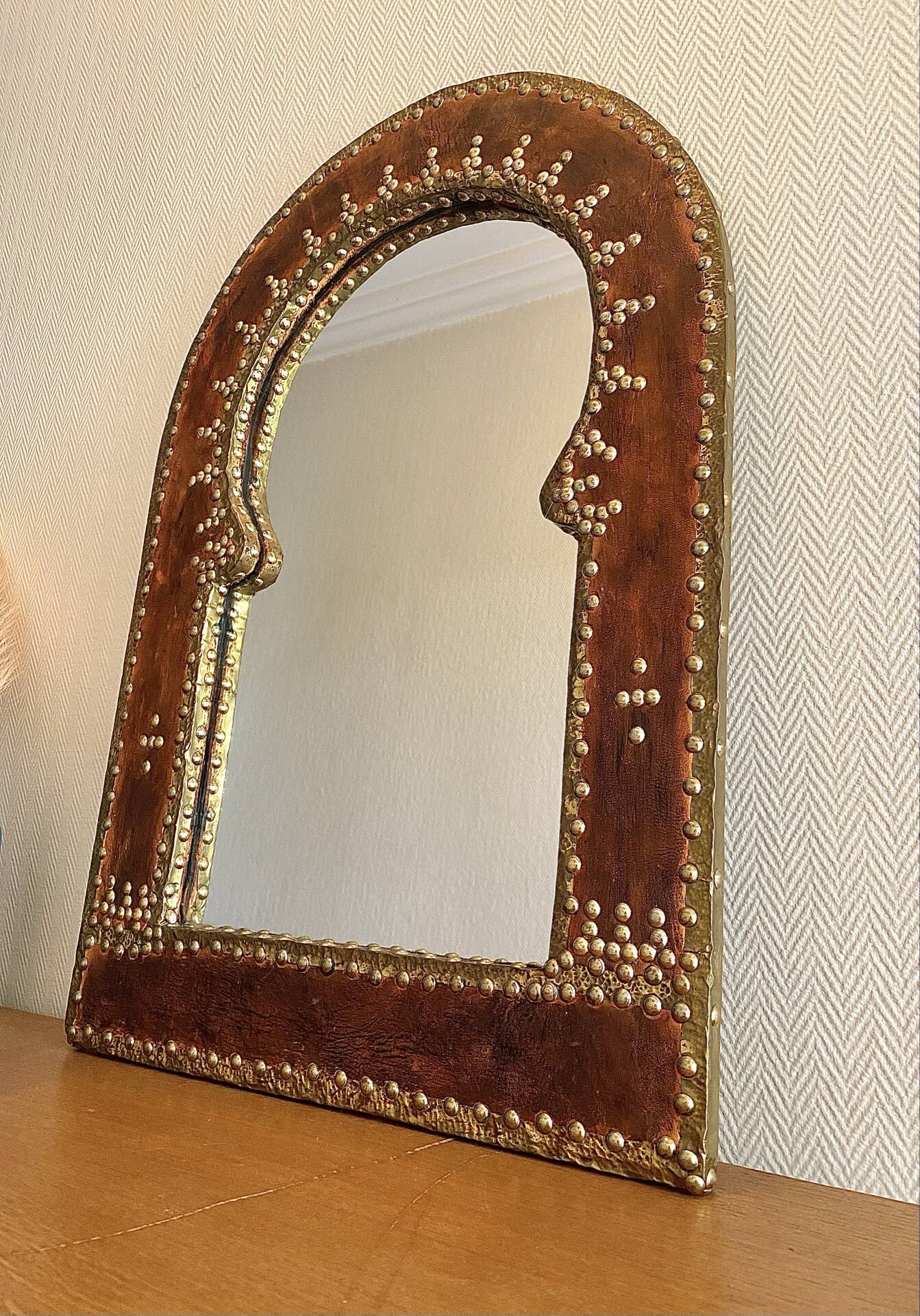 Large vintage mirror in studded leather and brass
