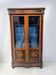 Napoleon III display cabinet in rosewood veneer and marquetry, 19th century.