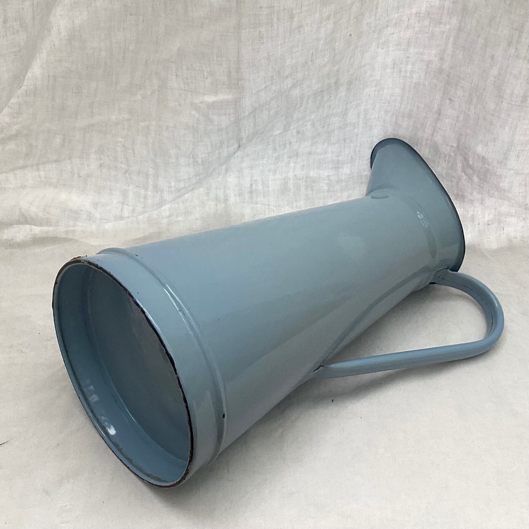 Old broc in enamelled sheet metal light blue color