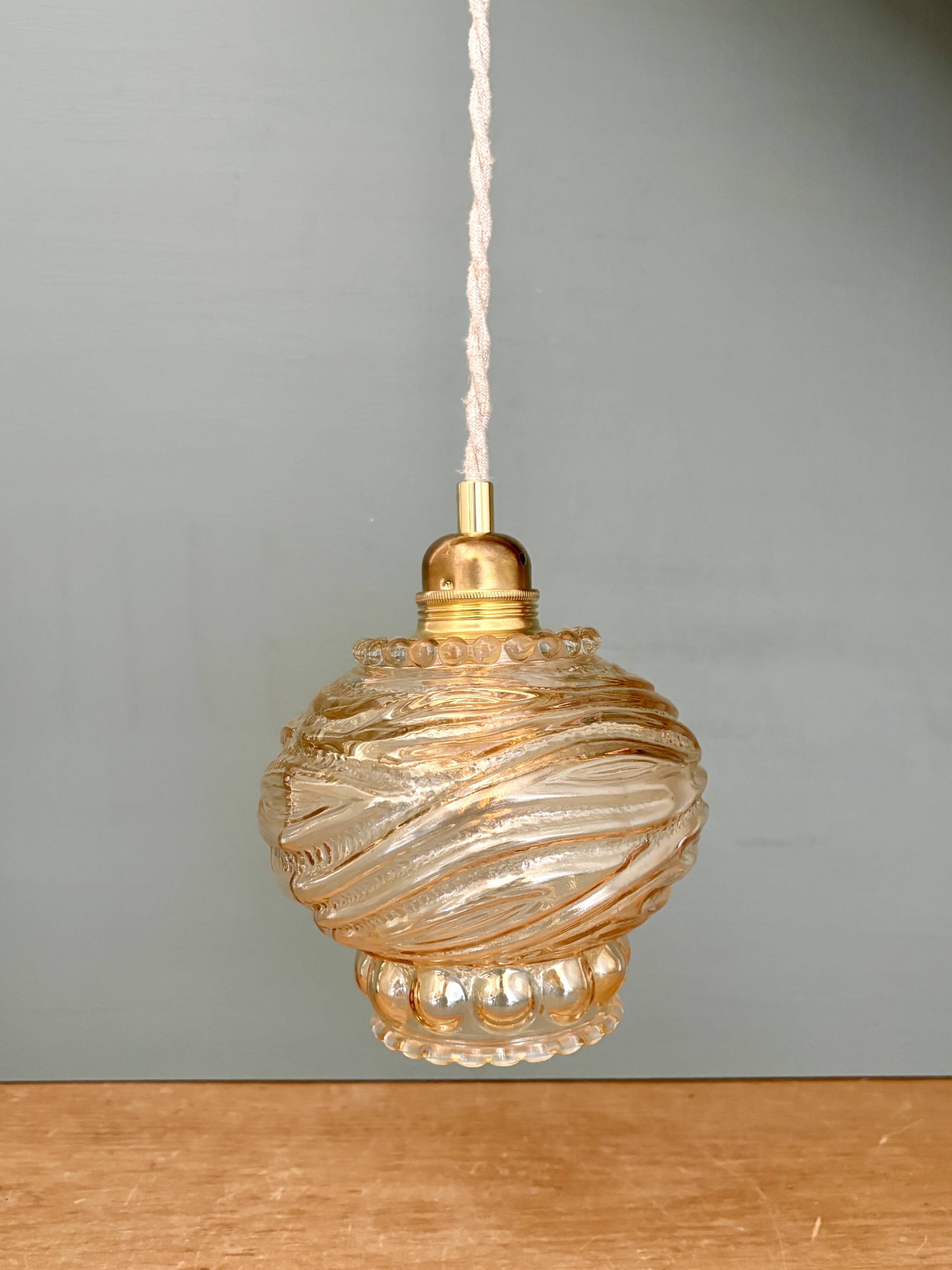Vintage amber glass suspension globe