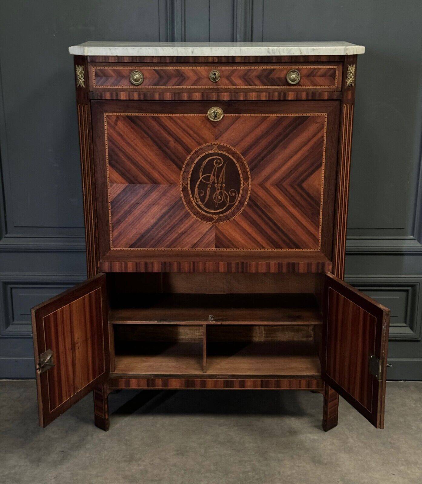 Louis XVI period secretary in monogram marquetry and white marble
