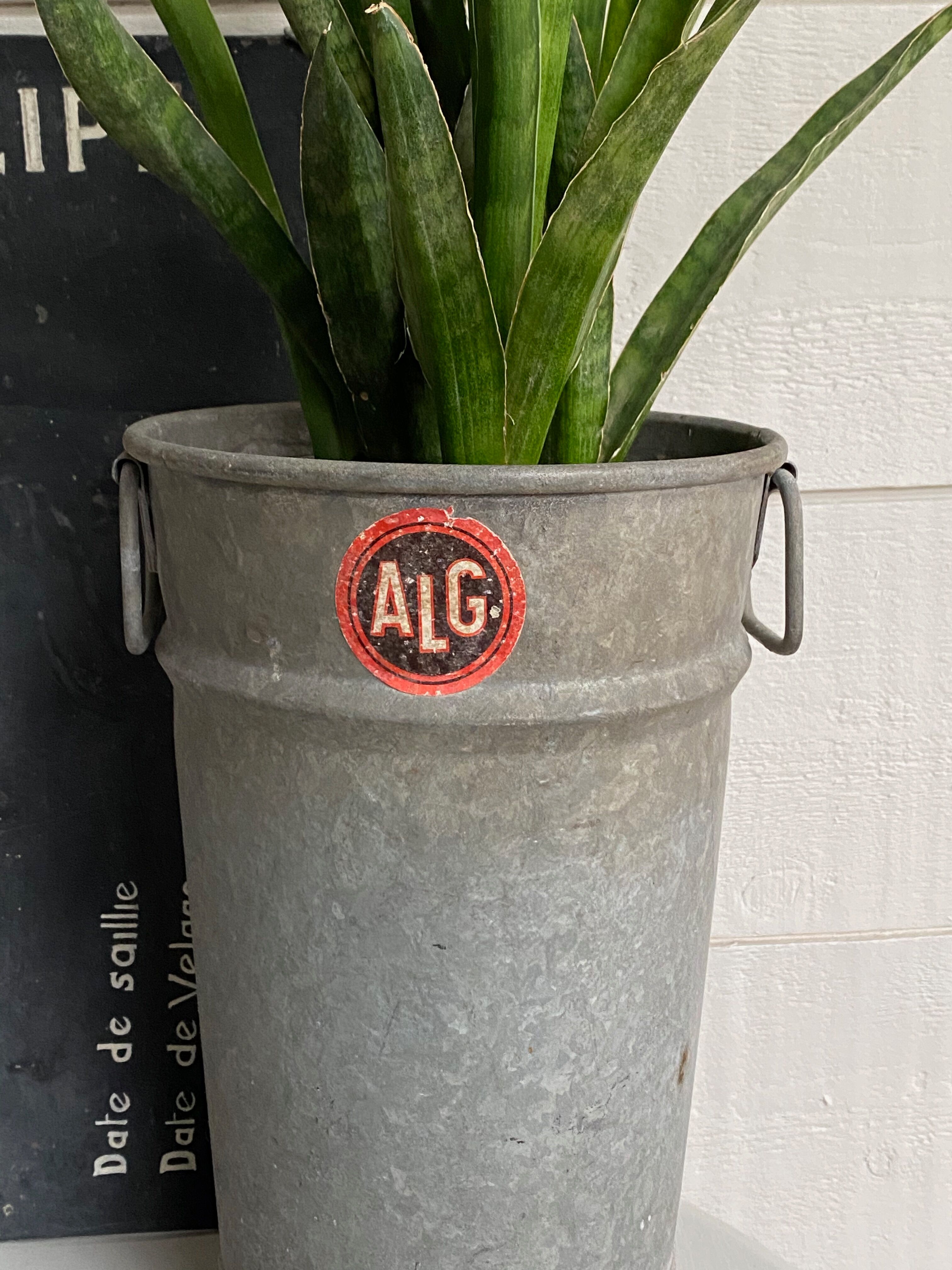 Old zinc florist vase
