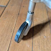 Vintage side table on wheels – black glass top