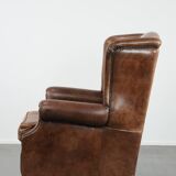 Warm, cosy and comfortable vintage sheepskin ear armchair with character