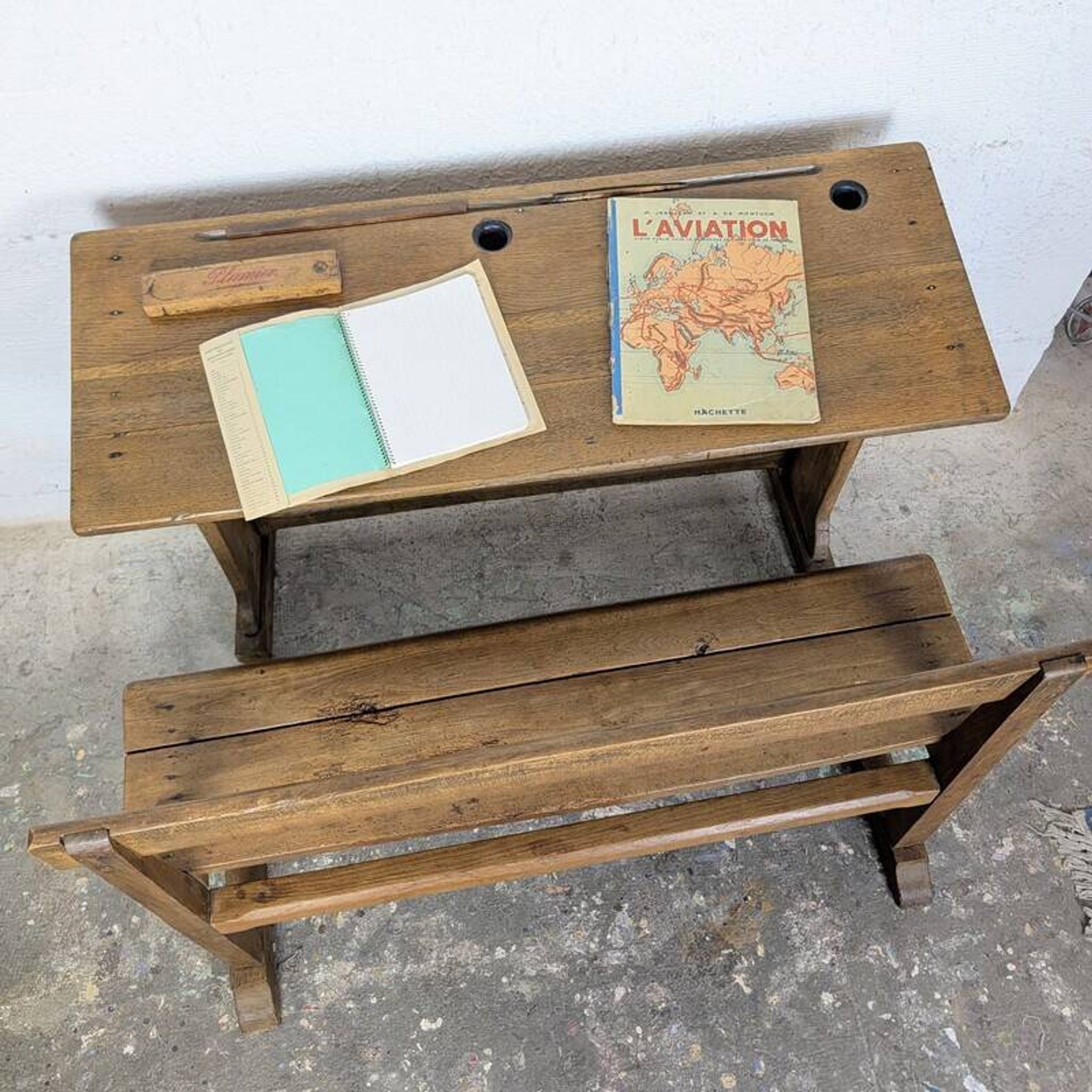 Double school desk and its wooden bench