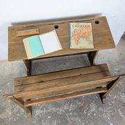 Double school desk and its wooden bench