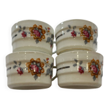 Set of 4 fine porcelain coffee cups with floral patterns and silver accents.
