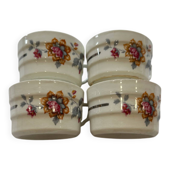 Set of 4 fine porcelain coffee cups with floral patterns and silver accents.