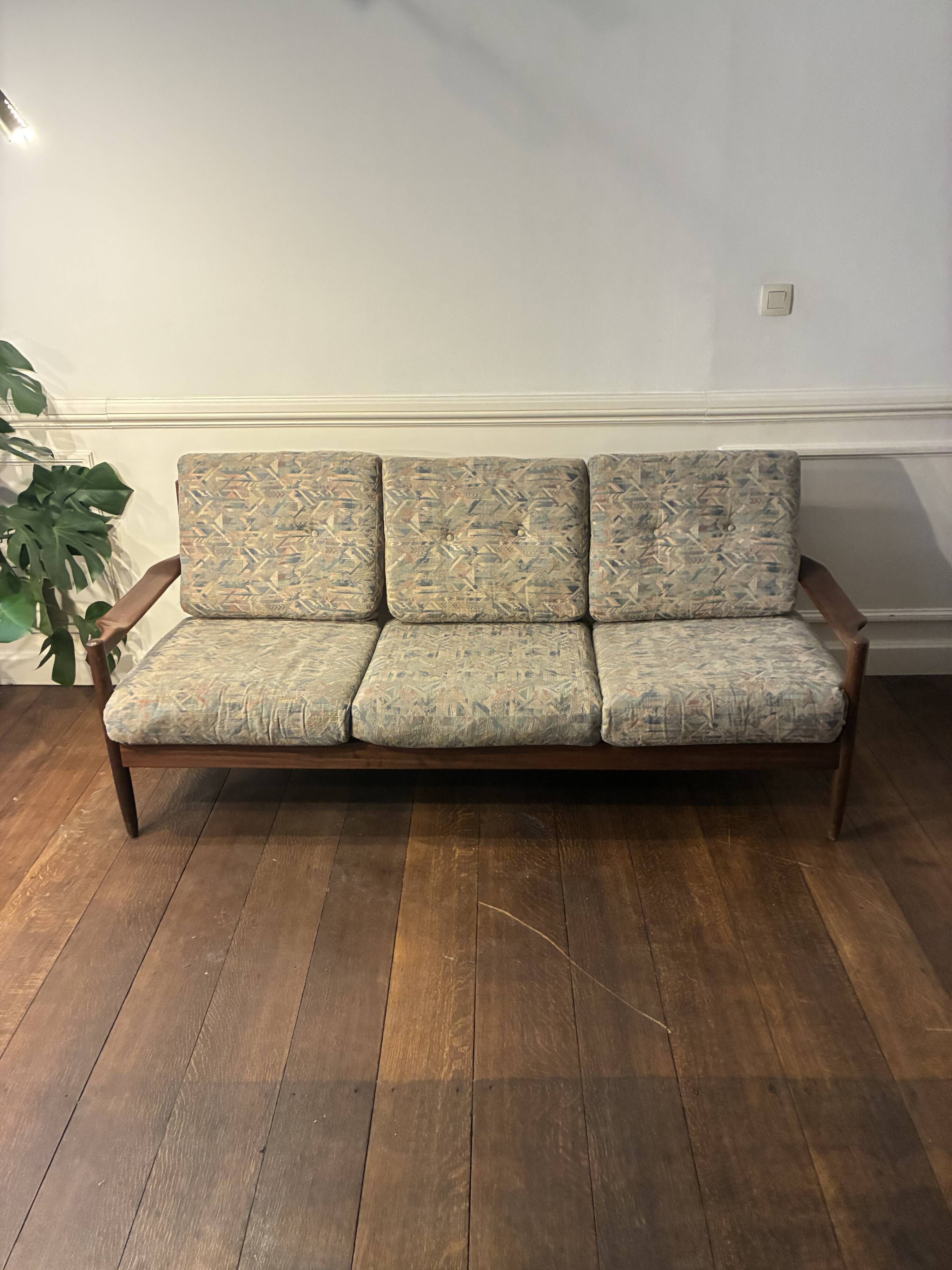 Vintage three-seater sofa — wood and sculptural backrest