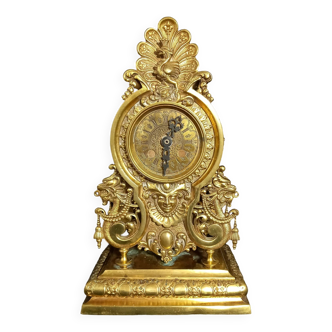 Pendule style napoléon iii en bronze doré avec dragons et paon