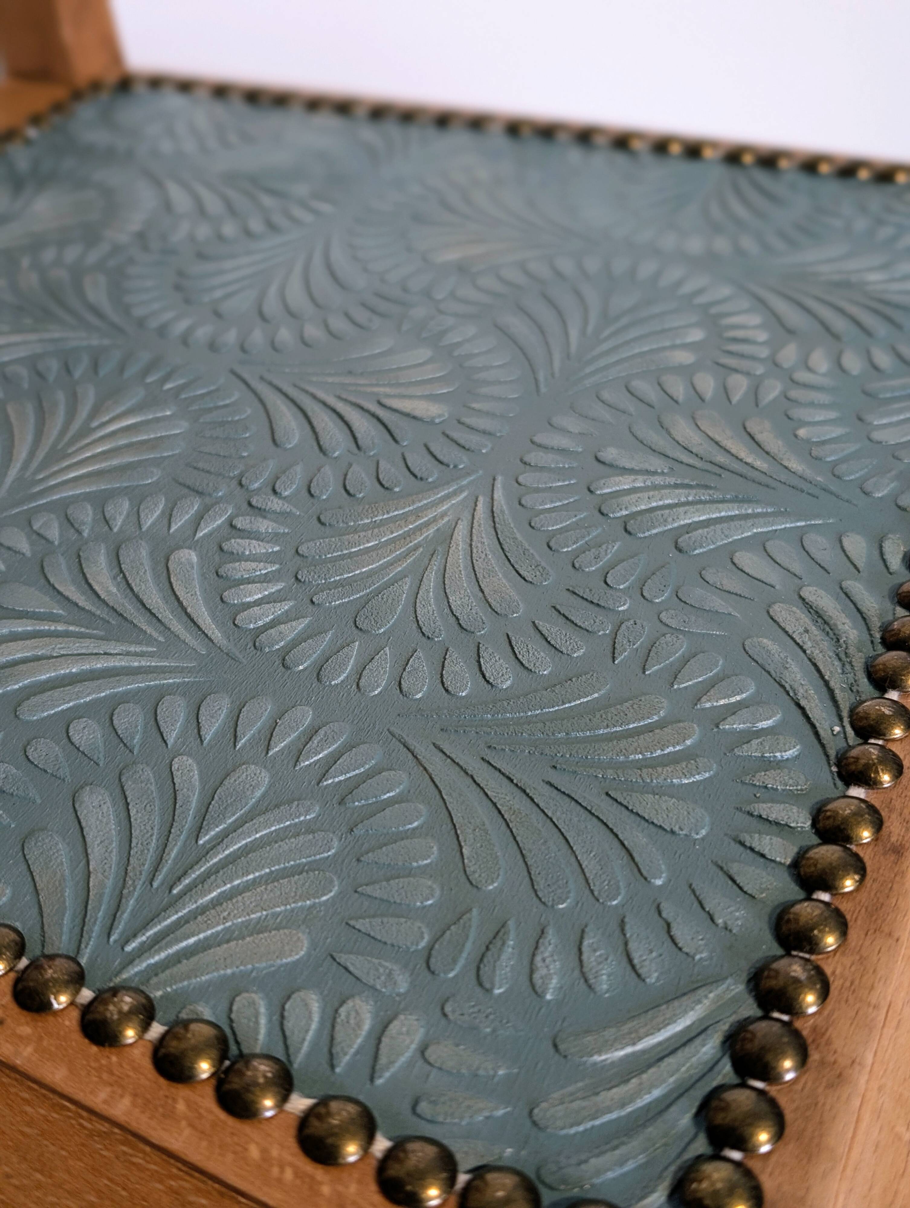 Revisited antique chair in solid wood with a sage green seat.