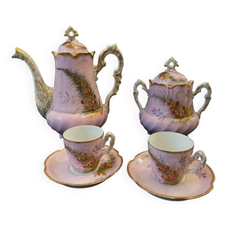 Paris porcelain coffee service, 19th century floral decoration, pink background.