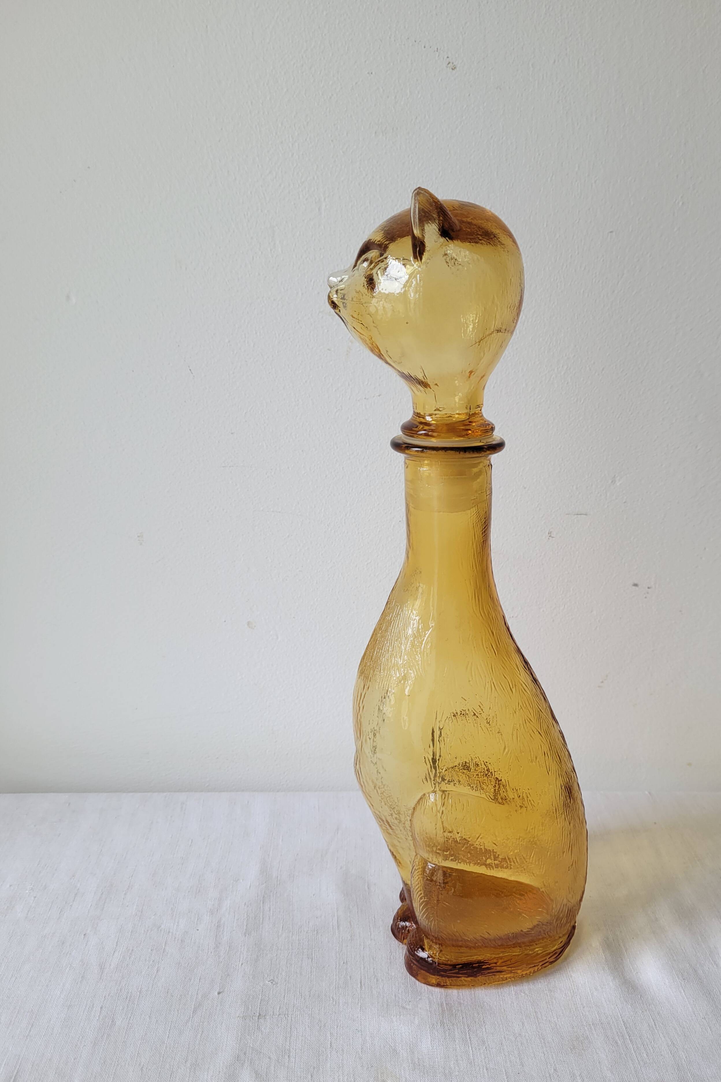 Zoomorphic carafe in amber glass