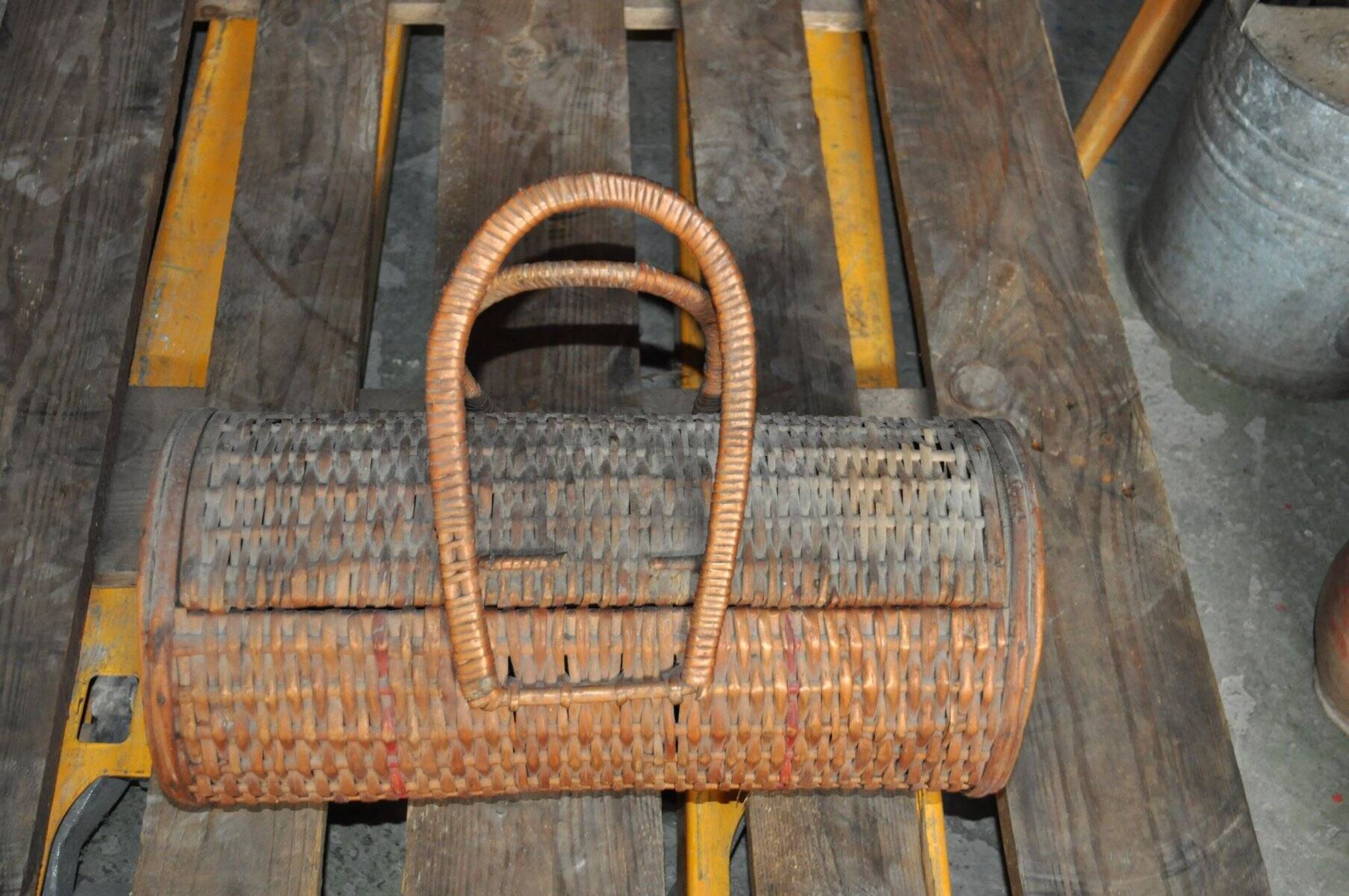 Vintage brown wicker cylindrical basket from the 1940s — long case for a bottle
