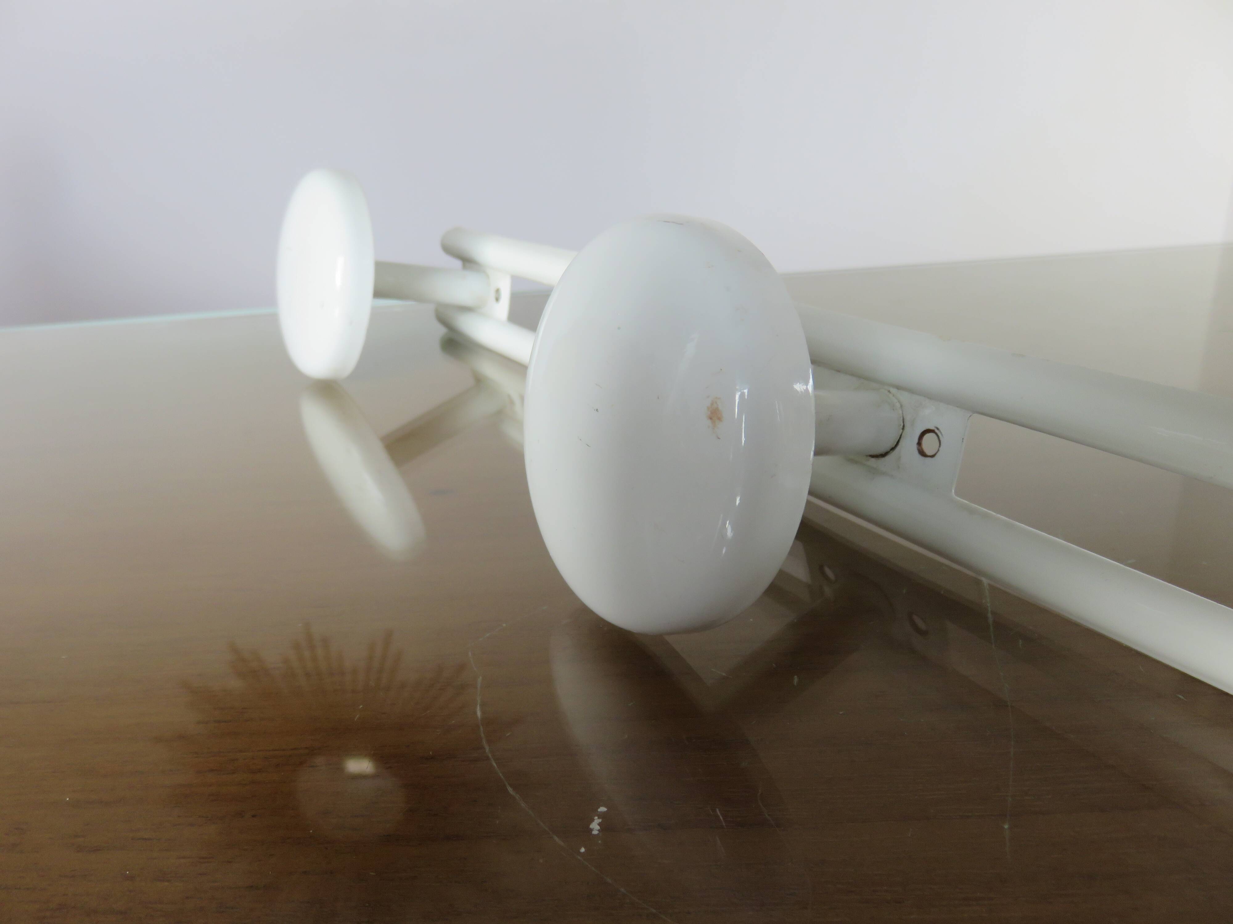 White lacquered metal wall coat rack with 3 hooks, 1970.