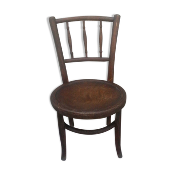 Antique children's chair in curved wood