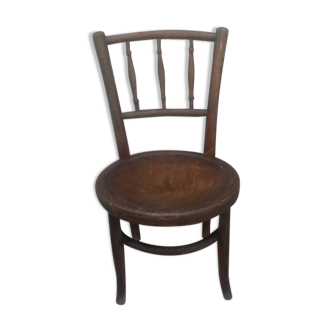 Antique children's chair in curved wood