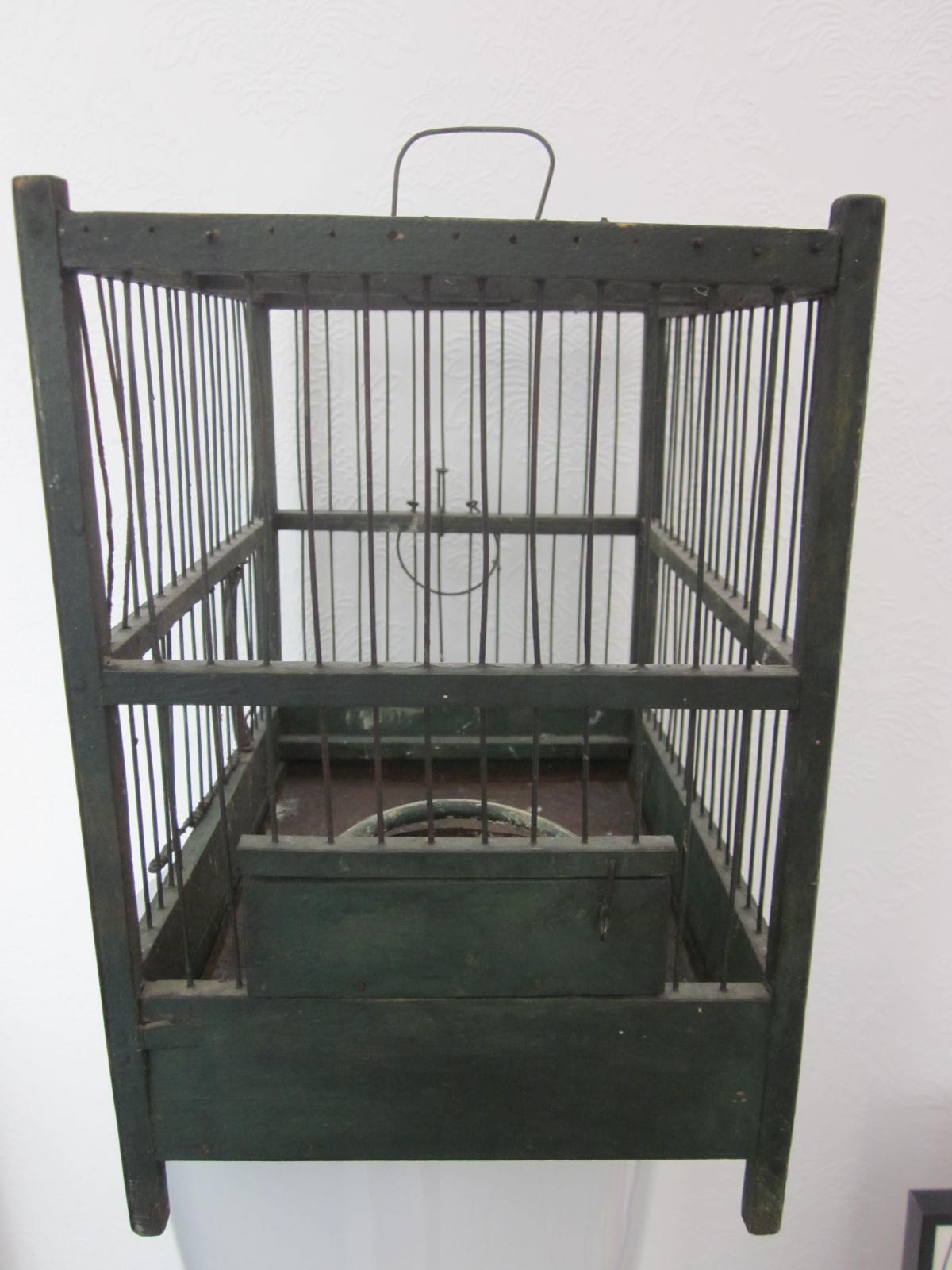 Wooden bird cage with feeder
