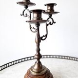 Pair of antique wooden and brass candlesticks