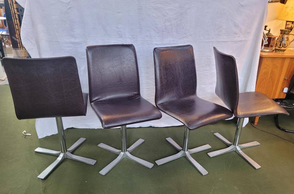 Set of 4 metal and imitation leather swivel chairs.