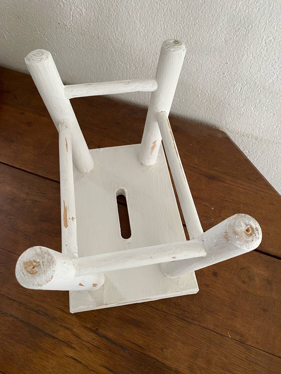 Small footrest bench in patinated white wood