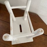 Small footrest bench in patinated white wood